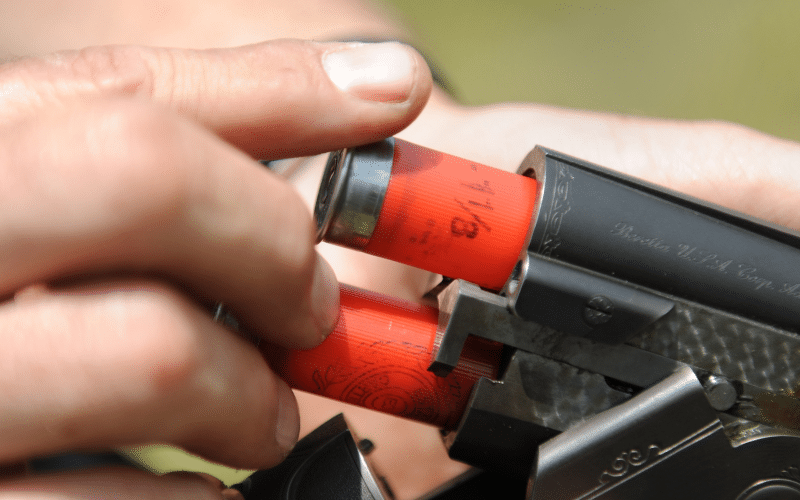 main loading two shotgun shells at the same time