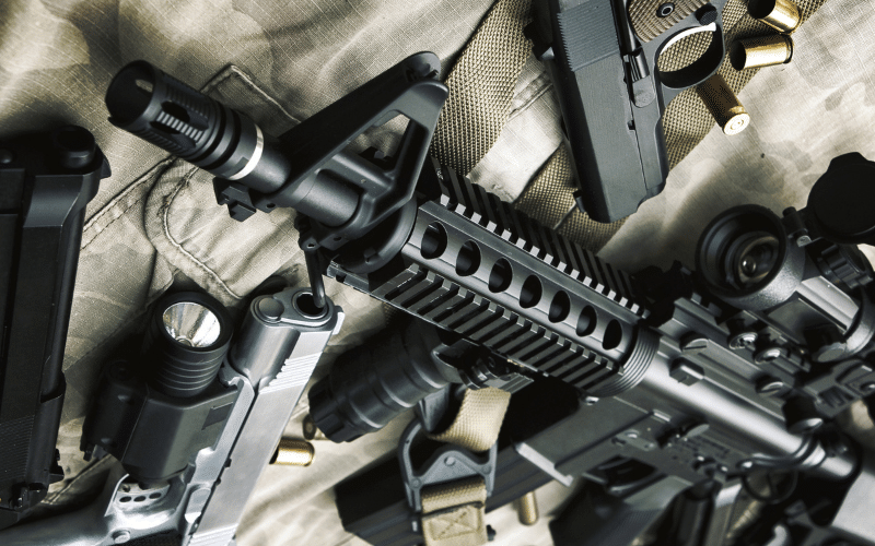 AR platform gun and pistols scattered