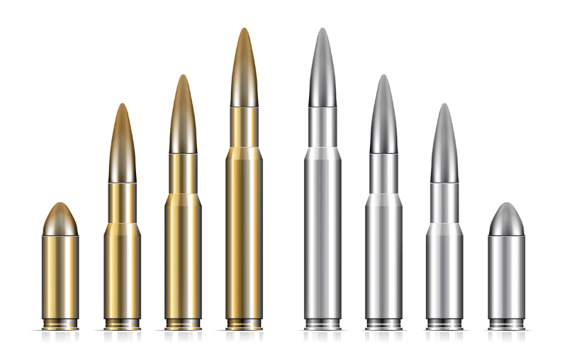 Golden and silver bullets with different heights lined up