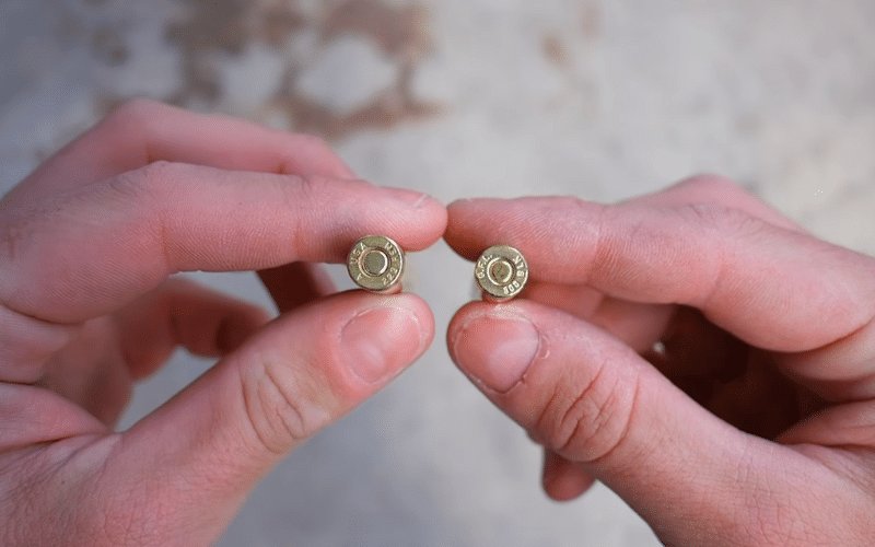 Two bullets in hands