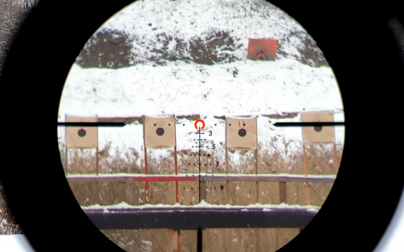 ACSS reticle aiming at snowy field with targets