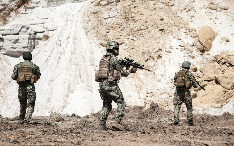 Three navy soldiers with full auto fire rifles