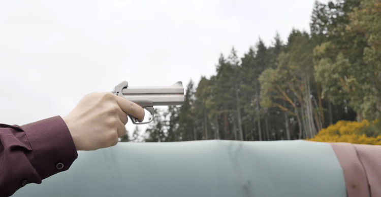 Author aiming the Mama Bear outdoors
