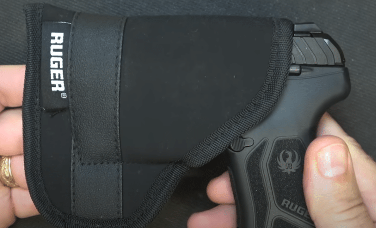 Compact pistol in a pocket holster

