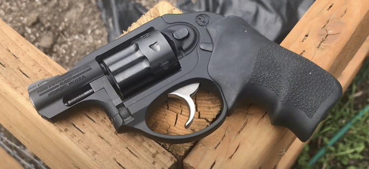 Ruger LCR 22 on a wooden post
