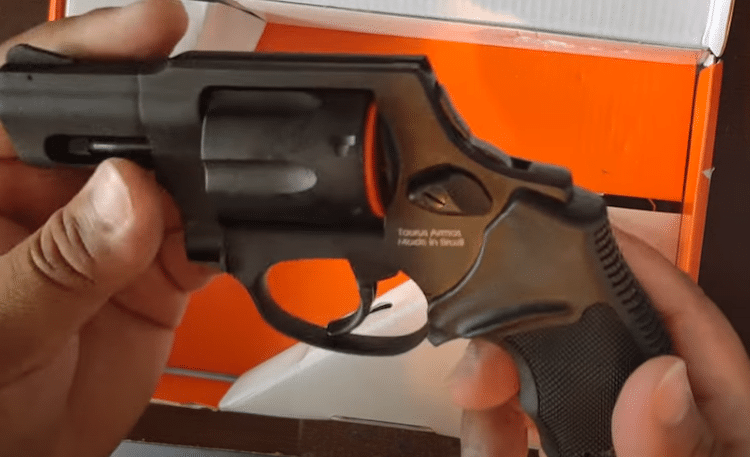Taurus revolver held sideways
