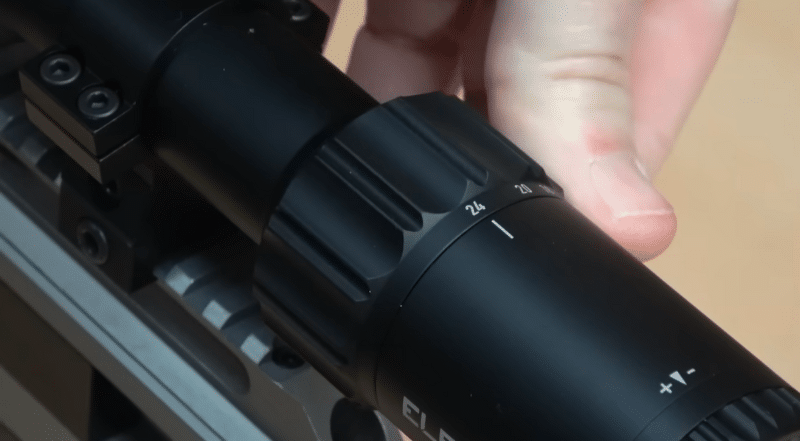 Thumb adjusting magnification ring on a scope
