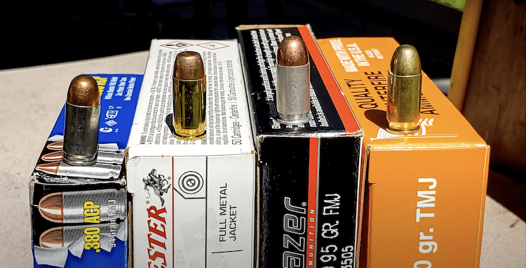 Different brands of 380 ammunition on top of each box