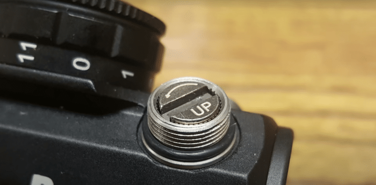 Image of the adjustment knob of a red dot scope