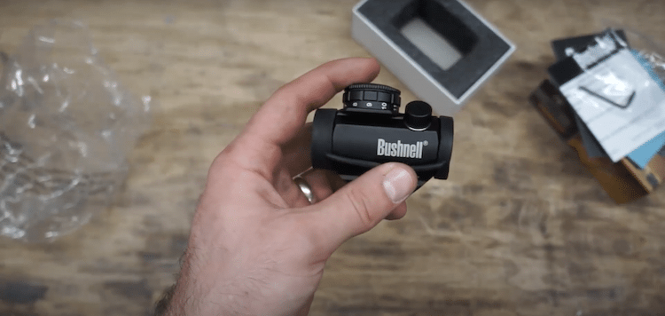 Hand holding a Bushnell Trophy 