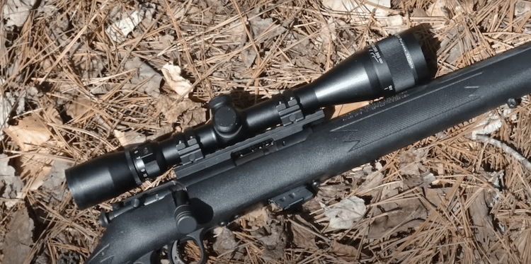 Mueller Optics scope and rifle on the ground