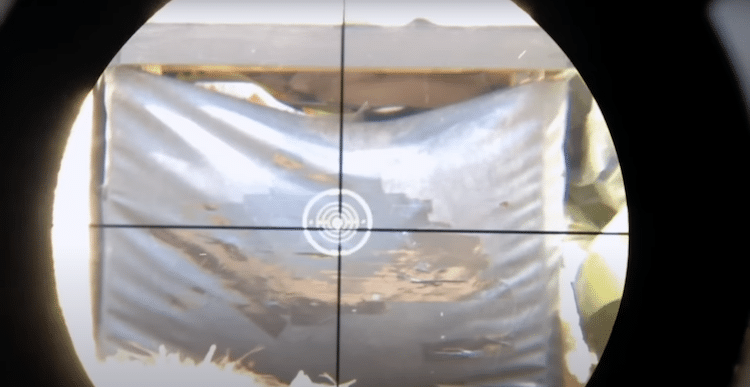 Target and reticle seen through the lens of a Mueller optic