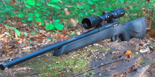 Thompson Center Arms Compass rifle on the ground outdoors